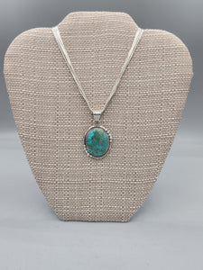 TURQUOISE PENDANT ON LIQUID SILVER  - DANIEL  BENALLY