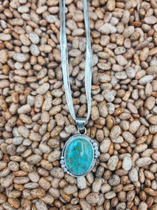 TURQUOISE PENDANT ON LIQUID SILVER  - DANIEL  BENALLY