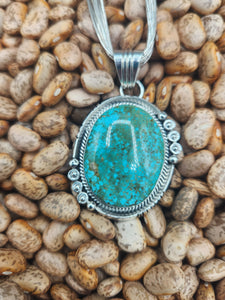 TURQUOISE PENDANT ON LIQUID SILVER  - DANIEL  BENALLY