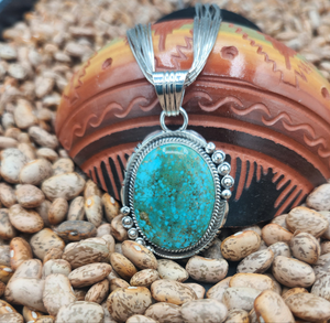 TURQUOISE PENDANT ON LIQUID SILVER  - DANIEL  BENALLY